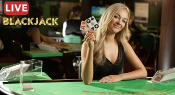 a dealer at a live blackjack table